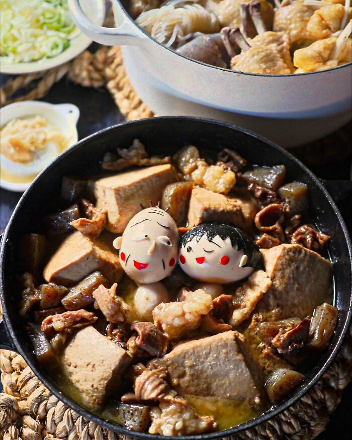 Japanese creative meals featuring character-inspired food art in a pot with tofu and various ingredients for kids.
