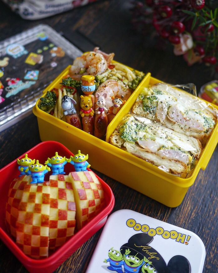 Colorful and creative kids meal in a bento box with character-themed food decorations and healthy ingredients.