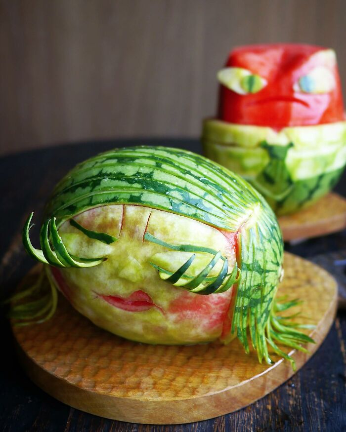 Watermelon carved into creative meals with detailed faces by a mom from Japan, designed to delight her kids.