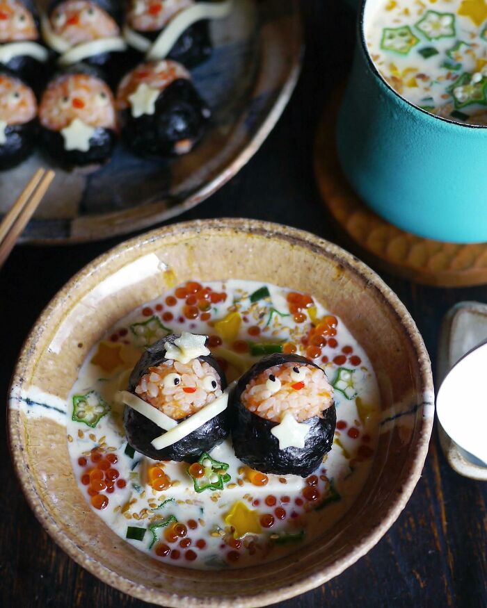 Creative Japanese kids meals featuring rice balls decorated as cute characters in a colorful and playful food presentation.