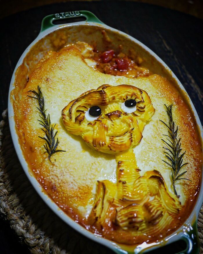 Creative meal shaped like a cartoon character in a baking dish, showcasing incredibly creative meals for kids from Japan.