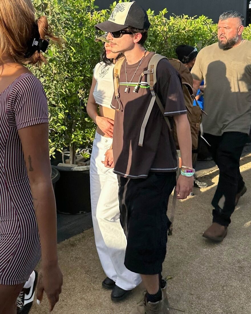 Timothée Chalamet wearing sunglasses and a cap, walking outdoors with a Kylie Jenner, highlighting Timothée Chalamet relationships. Timothée Chalamet wearing sunglasses and a cap, walking outdoors with a Kylie Jenner, highlighting Timothée Chalamet relationships.