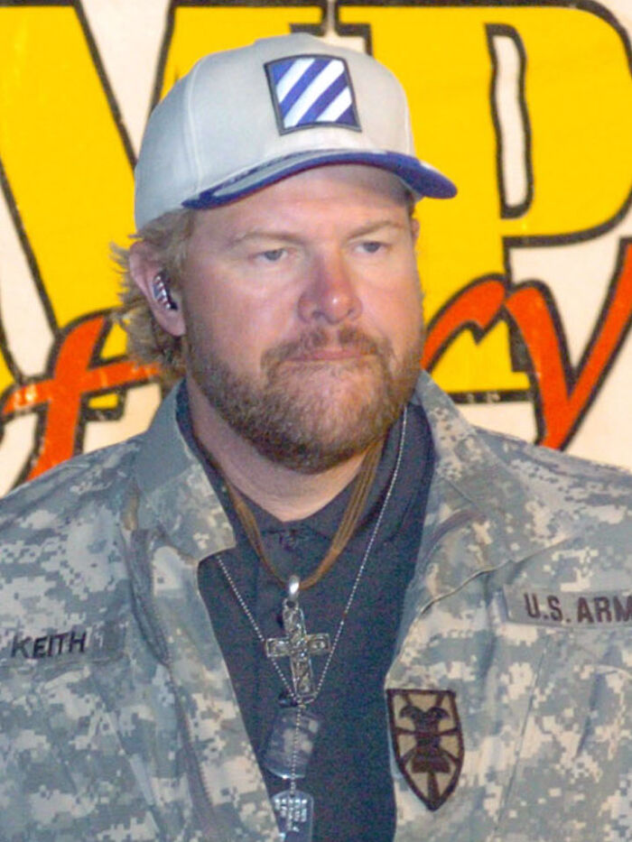 Man in U.S. Army uniform and cap with cross necklace, representing celebrity encounters and worst experiences theme.