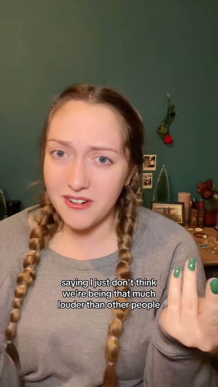 Young woman with braided hair speaking indoors with text overlay about louder Americans in a casual setting, Olympic Gold Medalist context.