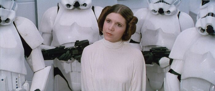 Princess Leia surrounded by stormtroopers, a well-written female character from movies breaking stereotypes.