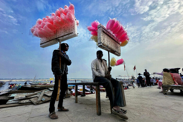 Two men selling cotton candy by the waterfront, capturing candid moments of everyday life in Istanbul.