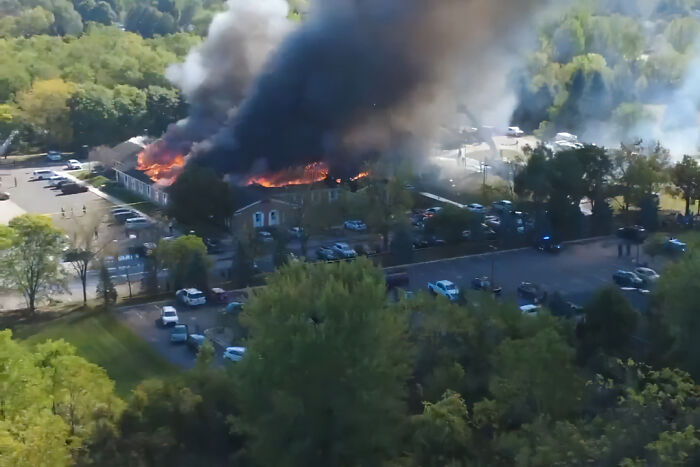 Aerial view of Michigan church on fire with smoke rising, linked by conspiracy theorists to Charlie Kirk attack. Aerial view of Michigan church on fire with smoke rising, linked by conspiracy theorists to Charlie Kirk attack.