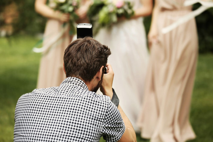 Photographer capturing images at a wedding interrupted by bride&rsquo;s sister confronting over school project photoshoot.