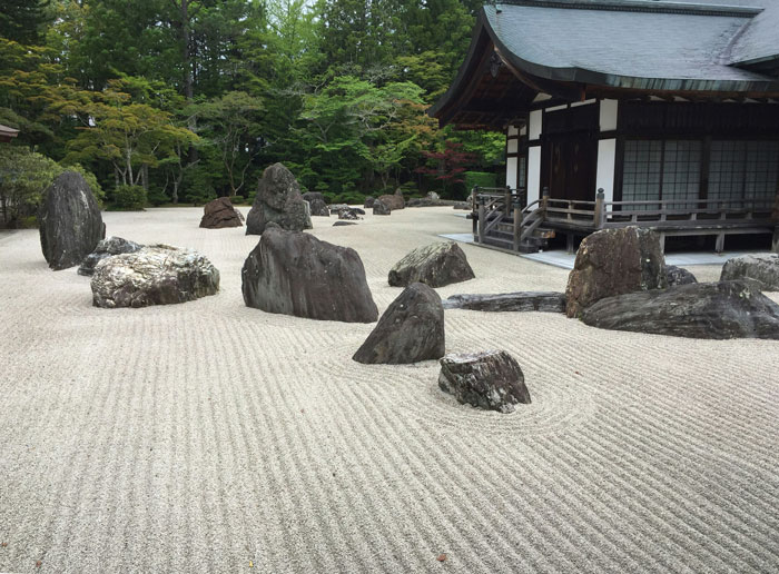 Zen rock garden at a park with no-walking area, illustrating a peaceful setting before toddler causes drama with a stranger and mom.
