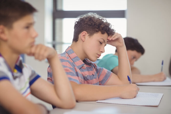 Teen boys focusing on schoolwork, reflecting on high school glory days and envisioning where life took them next.