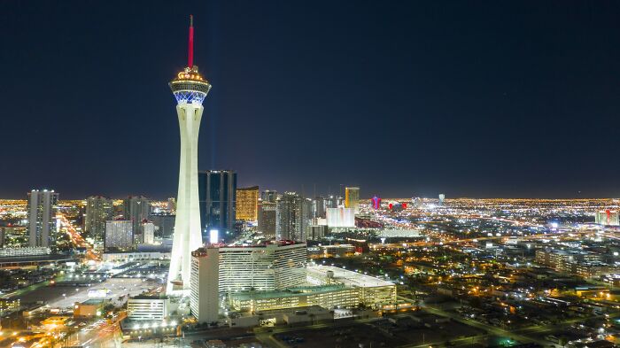 Las Vegas city skyline at night, showcasing bright lights and iconic tower, illustrating Americans finding loopholes.