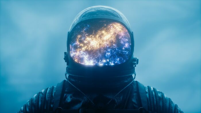 Astronaut in a reflective helmet showing a galaxy, representing unbelievable things that were actually true.