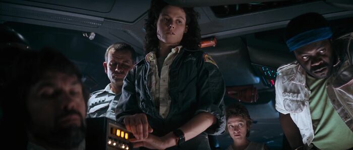 Female character in a dark sci-fi setting showing strong leadership, representing well-written female characters in movies breaking stereotypes.