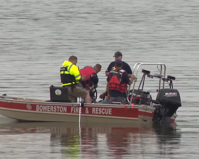 Rescue team on boat in water during recovery efforts related to Amish mom&rsquo;s chilling confession after drowning incident.