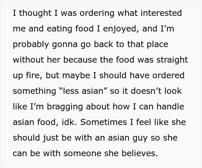 Person reflecting on ordering food and considering cultural aspects while ordering fried pork intestine at a restaurant.