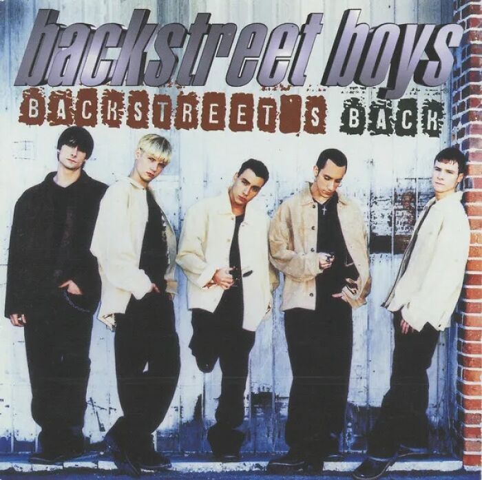 Backstreet Boys posing against a wall, wearing 90s style clothing, evoking nostalgia from the dawn of the internet era.