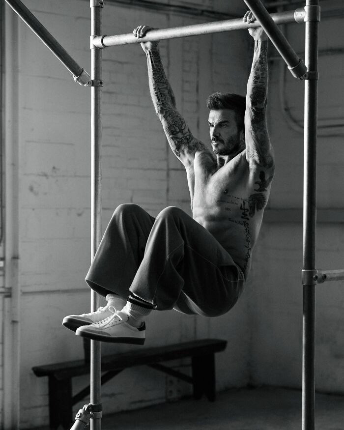 Beckham performing a pull-up exercise, showing his tattooed body with a doctor&rsquo;s dangerous health sign concern.