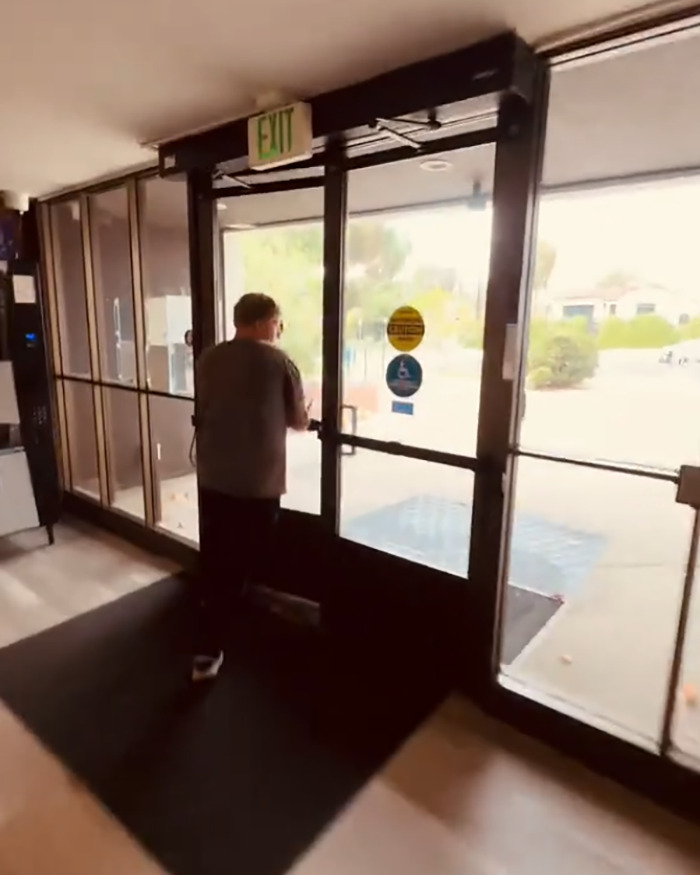 White man running away from library after confrontation with Black man over racial slur in viral video.