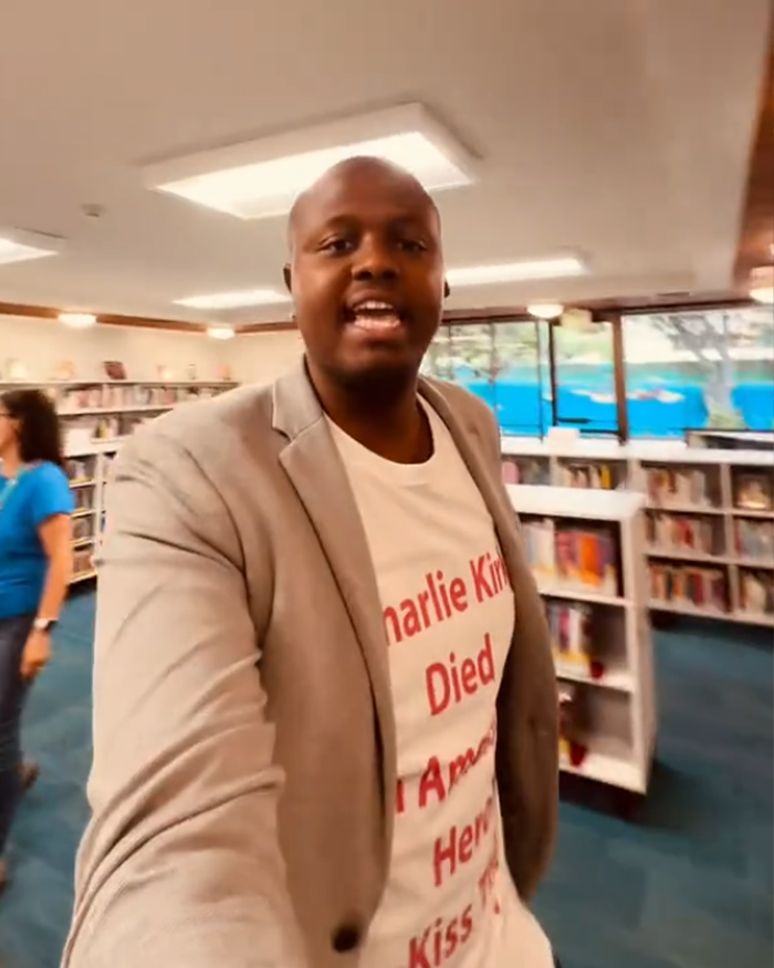 Black man confronting another man at library, addressing racial slur, captured in viral video moment.