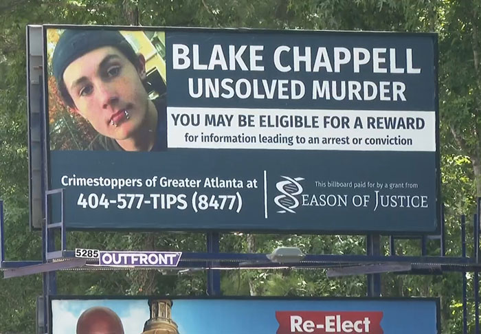 Billboard showing Blake Chappell unsolved murder case, seeking information in cold case breakthrough by police.