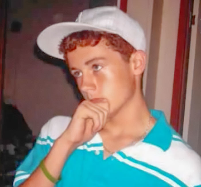 Teen boy in a white cap and blue shirt appears thoughtful, linked to major cold case breakthrough after anonymous letter.