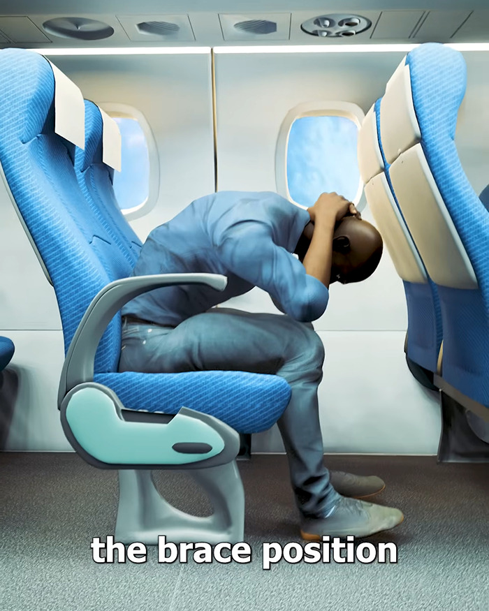 Passenger demonstrating the brace position during a chilling plane crash simulation to show what not to do in an emergency. Passenger demonstrating the brace position during a chilling plane crash simulation to show what not to do in an emergency.