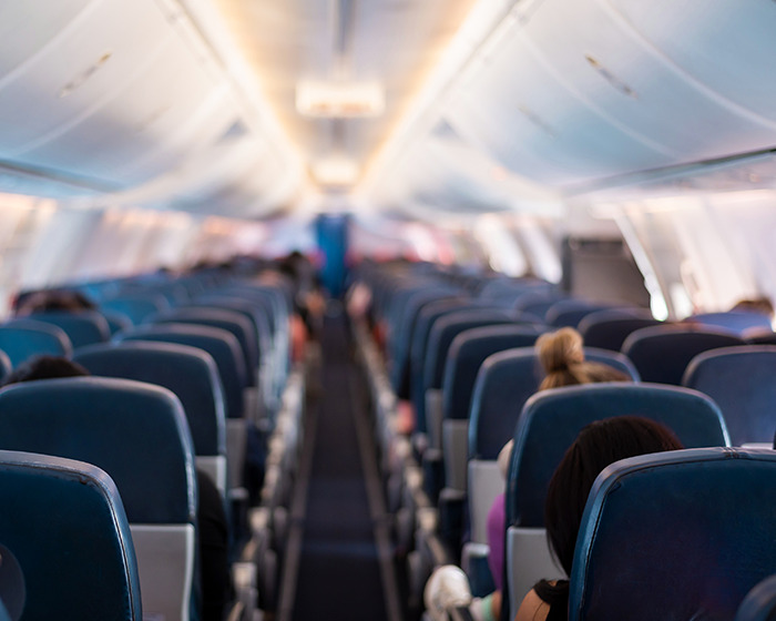Passengers seated inside a plane cabin during a chilling plane crash simulation highlighting emergency safety measures. Passengers seated inside a plane cabin during a chilling plane crash simulation highlighting emergency safety measures.
