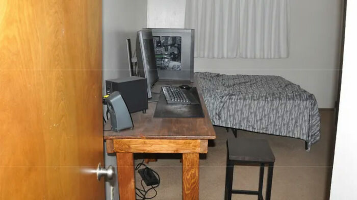 Prison room with a desk, computer, and bed linked to Bryan Kohberger Idaho crimes discussion before arrest.