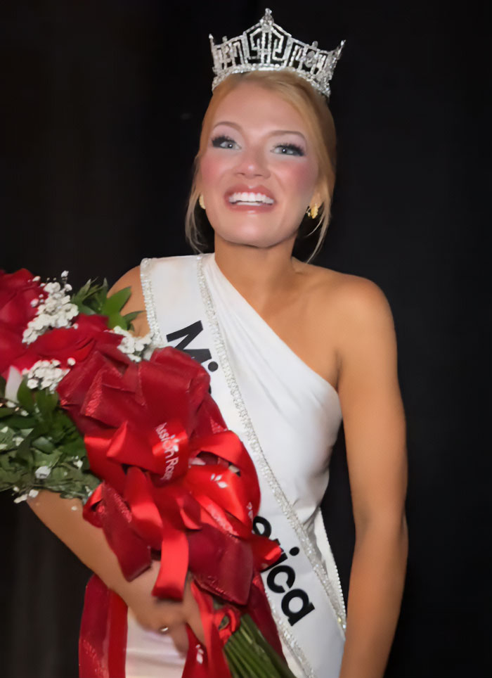 Miss America winner wearing crown and sash, holding bouquet, addressing backlash over her look after winning.
