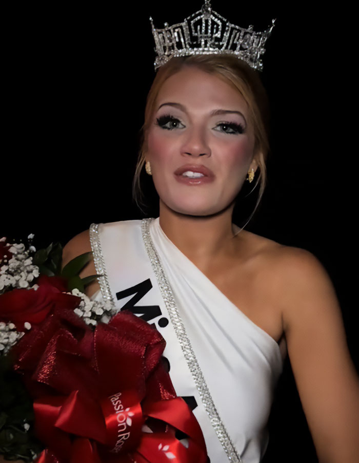 Miss America wearing crown and sash holding bouquet, addressing backlash over her look after winning the pageant.