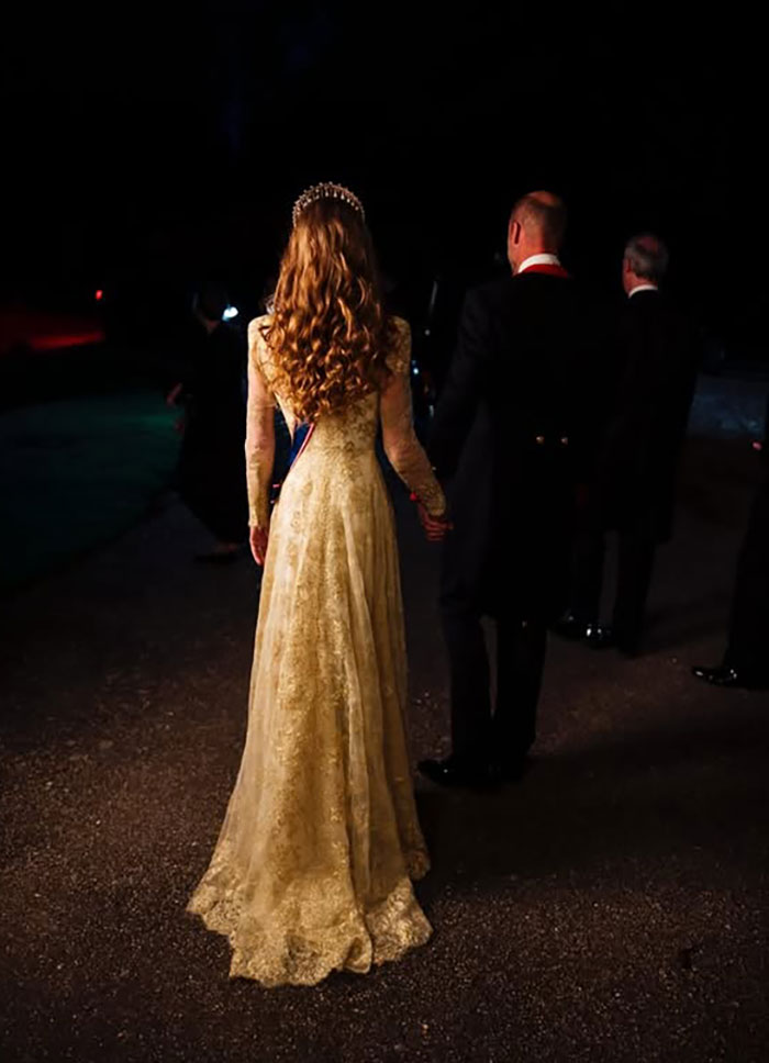 Kate Middleton in a gold gown standing with a man at a state banquet, highlighting unexpected Trump relative presence. Kate Middleton in a gold gown standing with a man at a state banquet, highlighting unexpected Trump relative presence.