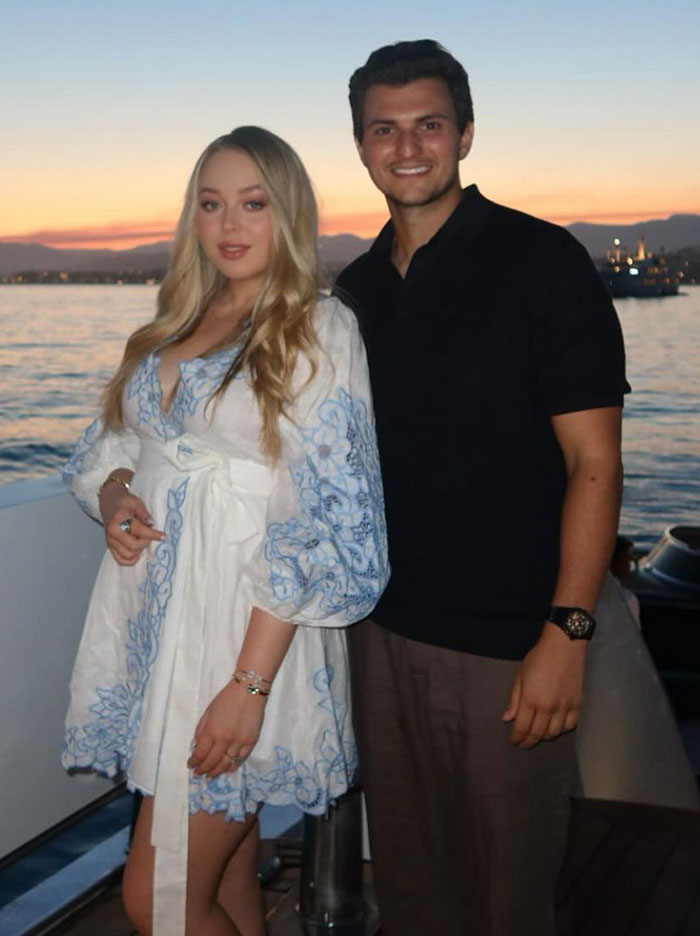 Couple posing on a boat at sunset, relating to Kate Middleton seated with unexpected Trump relative at state banquet. Couple posing on a boat at sunset, relating to Kate Middleton seated with unexpected Trump relative at state banquet.