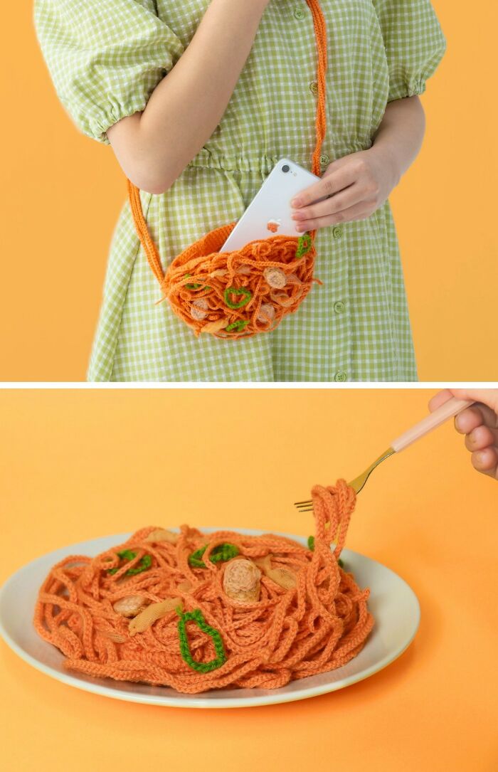 Crocheted realistic food-inspired accessories resembling spaghetti with vegetables held by a person in a green dress.