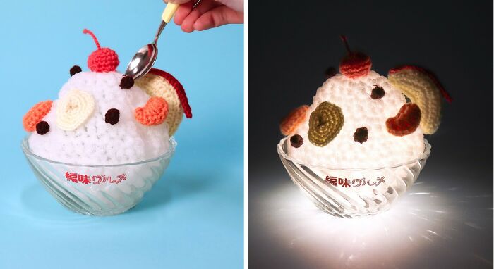 Crocheted realistic food-inspired accessory resembling ice cream with fruit pieces and a cherry on top in a glass bowl.