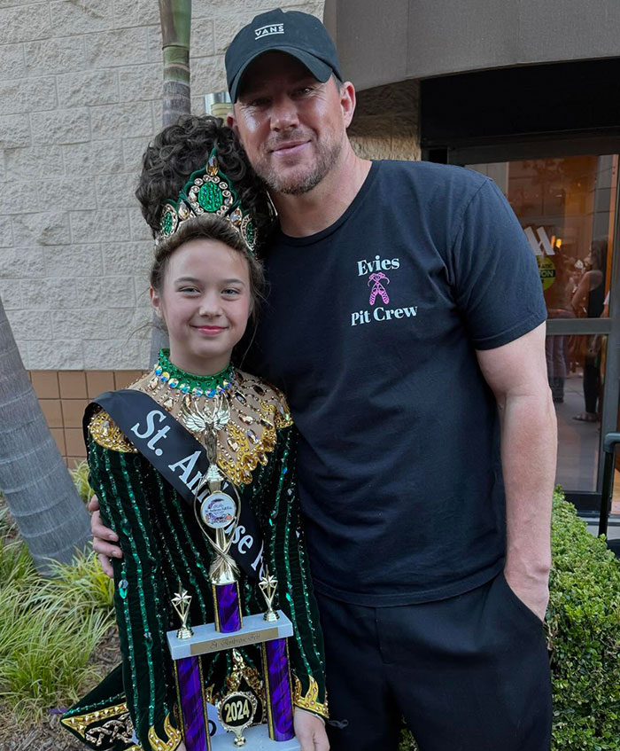 Channing Tatum, 45, posing with a young girl in a green Irish dance costume holding a 2024 trophy outdoors. Channing Tatum, 45, posing with a young girl in a green Irish dance costume holding a 2024 trophy outdoors.