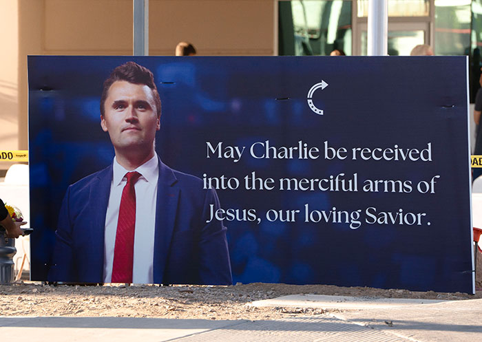 Memorial sign featuring Charlie Kirk with a message, related to Iryna Zarutska and a brutal crime fatal attack.