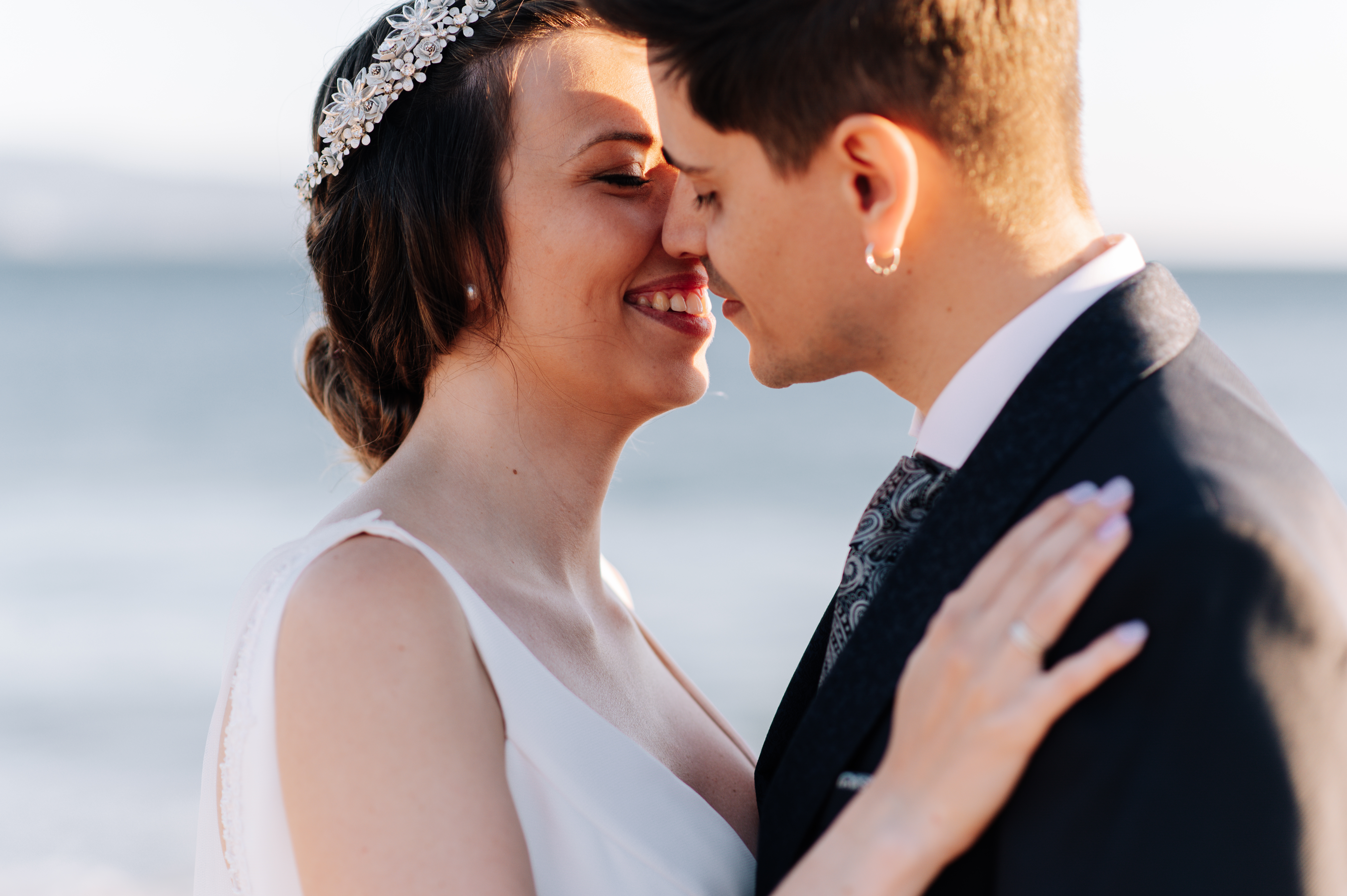 Bride and groom smiling close at wedding near the ocean, highlighting service dog refusal and wedding conflict topics Bride and groom smiling close at wedding near the ocean, highlighting service dog refusal and wedding conflict topics