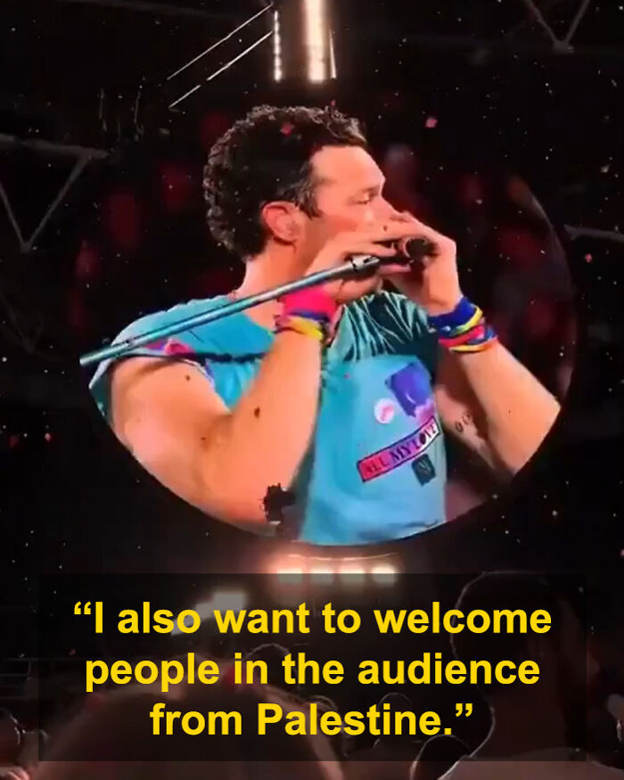 Chris Martin performing on stage at a concert, delivering a political speech to fans during a viral moment.