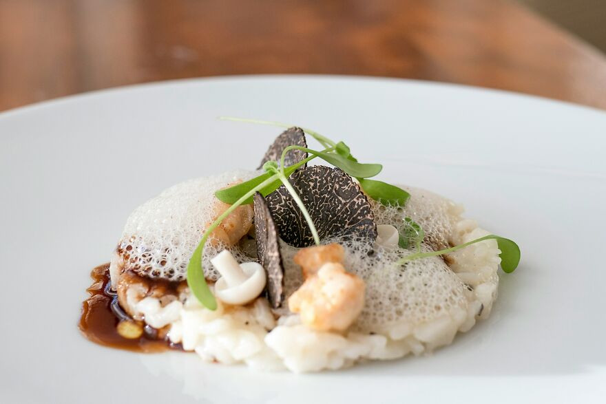 Gourmet dish featuring luxurious truffles and foam garnish, highlighting wealthy-favored superfood linked to ALS risk.