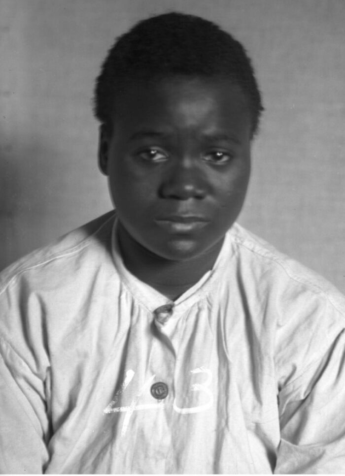 Portrait of a young person in vintage clothing, illustrating history anecdotes that reveal lessons from the past.