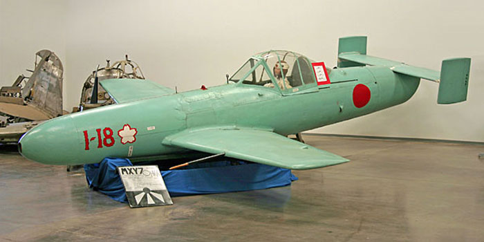 Vintage Japanese aircraft displayed indoors, illustrating unique history anecdotes that might teach you something new about the past.