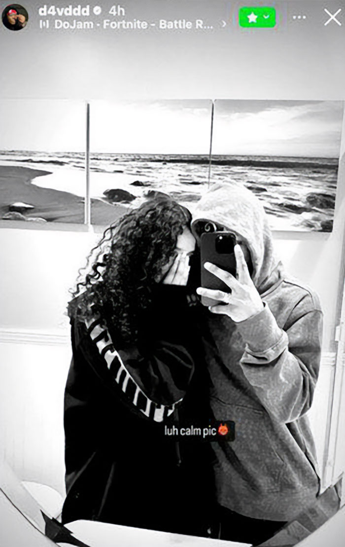 Black and white photo of two people taking a mirror selfie, related to family breaks silence after missing 15YO girl found.