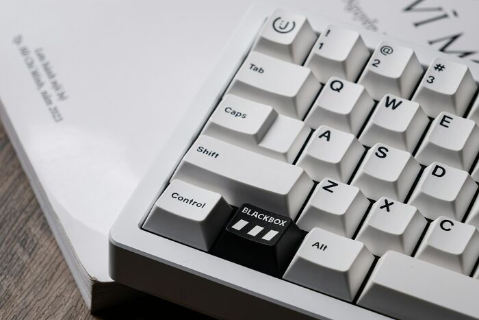 Close-up of a computer keyboard showing everyday things that humble fully grown adults with unique blackbox key design.