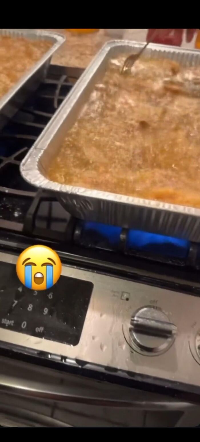 Large aluminum trays boiling on stove burners with water spilling over, illustrating risky edible cooking moments.