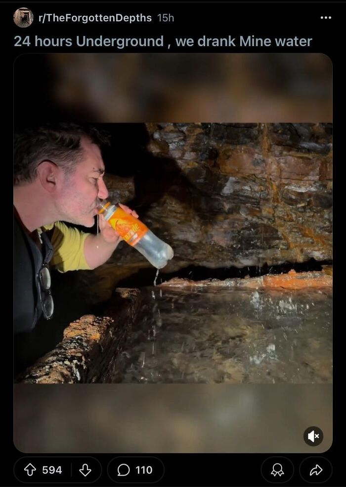 Man drinking water from a bottle inside an underground mine, illustrating people who came close to death and survived.