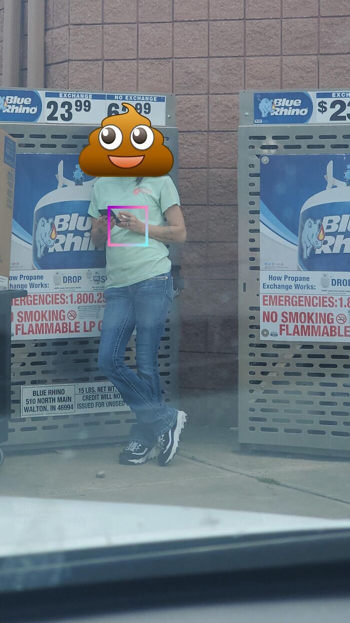 Person standing by propane exchange tanks, illustrating close calls with danger and anything being edible once concept.