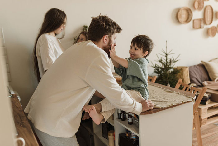 Father caring for toddlers at home while mother is away, highlighting husband left picking up the pieces after wife leaves.