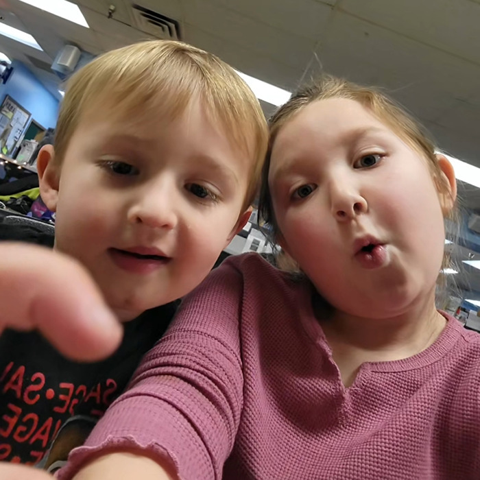 Two young children captured in a close-up selfie, related to tragic accident involving Disney influencer's family.