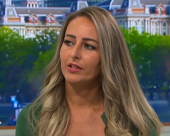 Woman with long blonde hair speaking in an interview about a domestic violence victim who credits Siri for saving her life