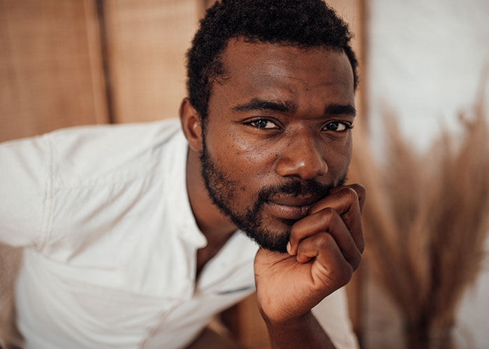 Thoughtful man looking ahead, representing stories of people who tried living double lives to fool others.